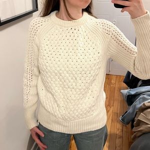 Ivory colored sweater with stitch detailings